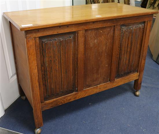 An oak carved box, W.94cm